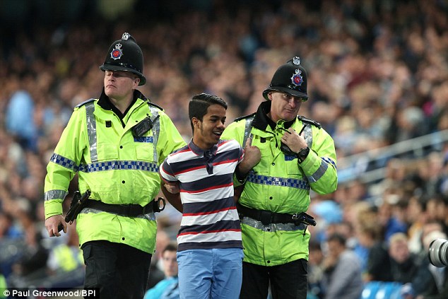 1411594129011 wps 88 A young fan is led away b 1