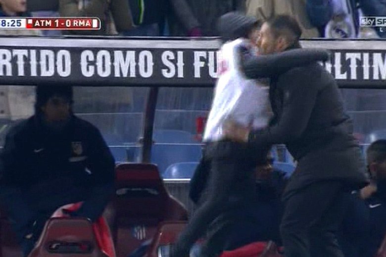 247D44EB00000578-2901036-Giuliano a ball boy for the cup match jumps into his father s ar-a-13 1420678567884