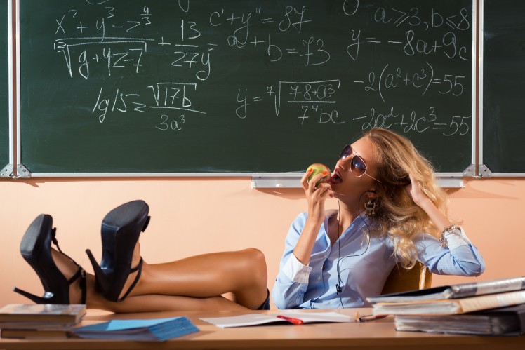 sexy teacher biting an apple