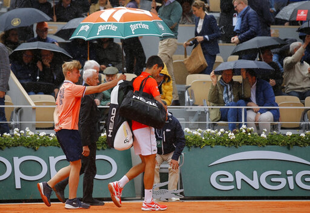 Ρολάν Γκαρός: Η βροχή νίκησε Τζόκοβιτς και Τιμ (photos)