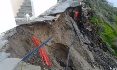 Σαντορίνη: Σπίτι και σκυλάκι στο χείλος του γκρεμού! (vid)