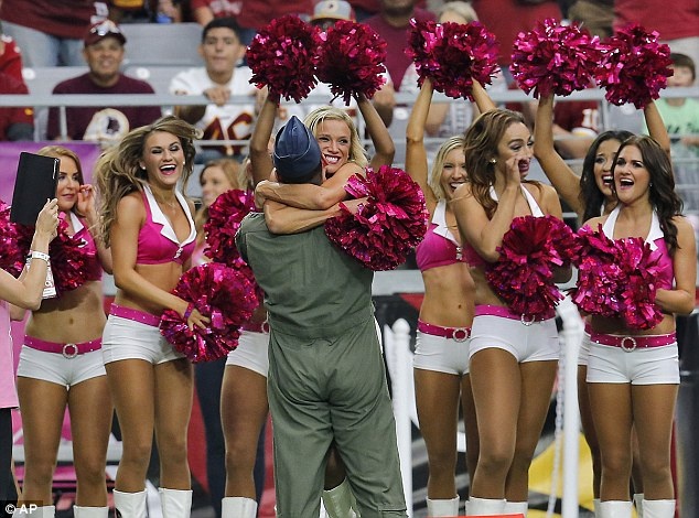1413157753217 wps 10 An airman hugs an Arizona
