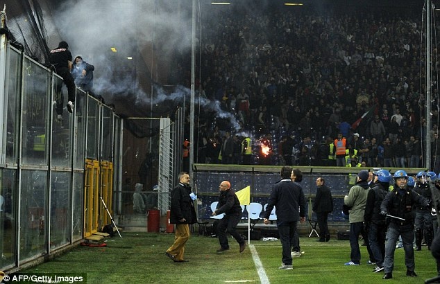 1413370438120 wps 8 Serbian fans L throw fire