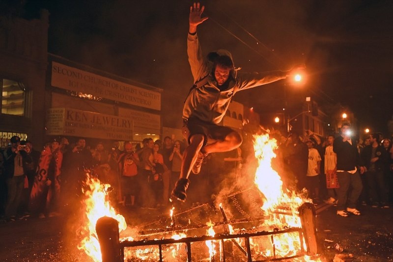 1a1414693793711 wps 10 A man jumps over some deb